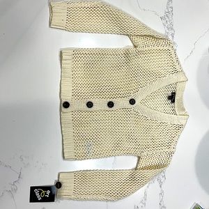 This piece is brand new never worn,kids art class,size7/8,cream colored cardigan